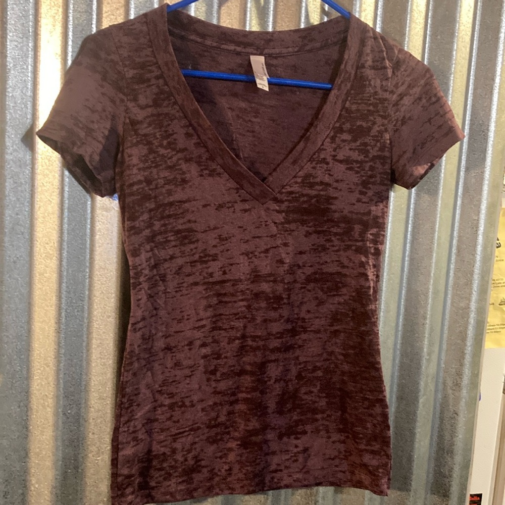 Womens tee size small maroon in color. Brand is Next Level